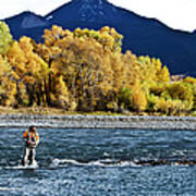 A Athletic Man Fly Fishing Stands In A Art Print