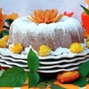 A Bundt Cake Coated With Icing Sugar And Decorated With Orange Flowers Art Print