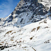 A Lonely Train Passing By The Eiger's North Face In Switzerland On A Sunny Spring Day. Art Print