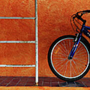 Bicycle Against Orange Wall Art Print
