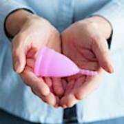 Close-up Of Hands Holding A Pink Menstrual Cup Art Print