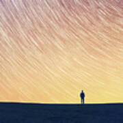 Man Standing On Hill, Star Trails Above Art Print