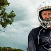 Portrait Of Man Wearing Crash Helmet Against Cloudy Sky Art Print