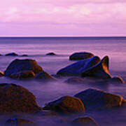Seascape With Some Rocks Protruding The Art Print