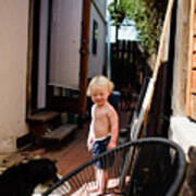 Shirtless Two Year Old Standing On Side Of House Smiling At Dog Art Print