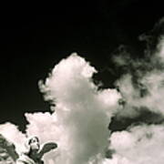 Statue Of Angel Against Cumulus Clouds Art Print