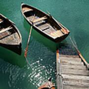 Steps Down To Wooden Boats Floating On Art Print