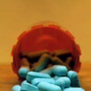 View Of Blue Pills Spilling From A Pot Art Print