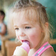 Young Cute Girl Happily Licking Pink Ice Cream On Summer Day. Art Print