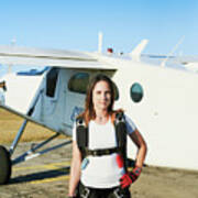 Young Female Skydiver With Backpack In An Airfield With Plane Art Print