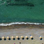 Aerial View From A Flying Drone Of Beach Umbrellas In A Row On An Empty Beach With Braking Waves. Art Print