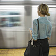 Caucasian Woman Standing Near Passing Subway In Train Station #1 Art Print