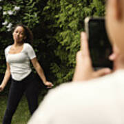 Mixed-race Teenage Sisters Filming With Mobile Phone In Backyard. #1 Art Print