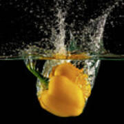 Yellow Bell Pepper Dropped And Slashing On Water Art Print