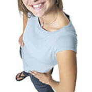 A Caucasian Female Teen In Jeans And A Blue Shirt Smiles Up At The Camera Art Print