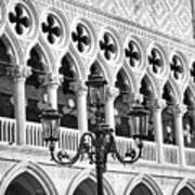 A Typical Venetian Street Lamp In Front Of The Ducal Palace Windows Art Print