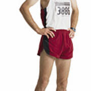 An Adult Caucasian Male Marathon Runner In Red Shorts And A White Tank Stands Smiling With Hands On Hips Art Print