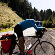An Exhausted Male Cyclist Leans Over His Touring Bike While Climbing Mattole Road Near Ferndale, California. Art Print