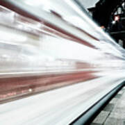 Blurred Train At Night Leaving Station Art Print