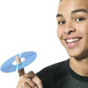 Close Up Shot Of A Teenage Male As He Holds Up A Cd On His Finger Art Print
