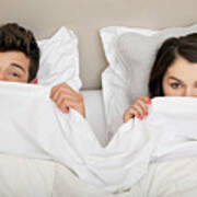 Couple In Bed Peeking Behind Duvet Art Print
