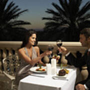 Couple In Evening Wear Having Dinner On Balcony, Toasting With Red Wine Art Print