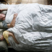 Elderly Caucasian Couple Sleeping On The Bed Art Print
