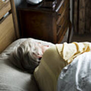 Elderly Caucasian Woman Sleeping On The Bed Art Print