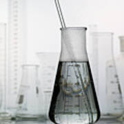 Erlenmeyer Flask With Laboratory Glassware In The Background Art Print