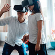 Father Using Virtual Reality Headset With His Daughter Art Print