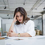 Female Entrepreneur With Headache Sitting At Desk Art Print