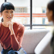 Female Young Asian Entrepreneur Smiling And Discussing Ideas With Colleague Art Print