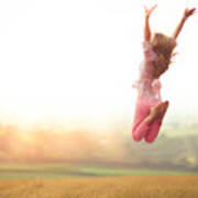 Girl Jumping In Harvested Wheat Field Art Print