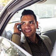 Hispanic Businessman Talking On Cell Phone In Back Seat Of Car Art Print