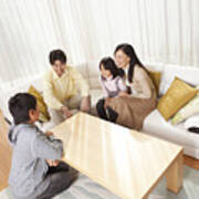 Japanese Family Relaxing In Their Home Art Print
