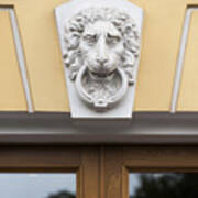 Lions Face Statue Carved On The Wall Of A Building Art Print