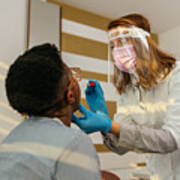Medical Worker Testing Black Woman For Possible Coronavirus Infection Art Print