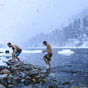 Men Walking On Stones In River During Snowfall Art Print
