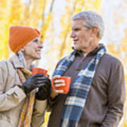 Older Caucasian Couple Drinking Coffee Near Autumn Trees Art Print