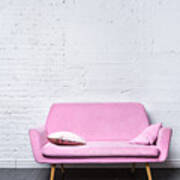 Pink Retro Sofa Against White Brick Wall Art Print