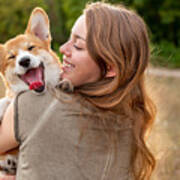 Portrait: Young Woman With Laughing Corgi Puppy, Nature Background Art Print