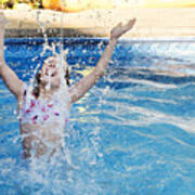 Preteen Girl Splashing Water In Backyard Pool. Art Print