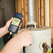 Repairman Checks Carbon Monoxide Level On Gas Water Heater Exhaust Art Print