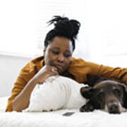 Sad Woman Lying On Bed With Dog Art Print