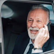 Senior Businessman Using Phone In Business Car Art Print