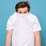 Shy Caucasian Man Hiding Behind His White Shirt Being Afraid Of Coronavirus. Art Print