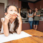 Studying Girl, Mother And Father Watching From Behind Art Print