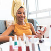 Teen Girl Using Cell Phone While Painting Her Nails Art Print