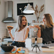 Two Teenage Girlfriends Filming A Music Video In The Kitchen With Smart Phone Art Print