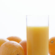 Whole Oranges By Orange Juice In Glass, Close-up Art Print